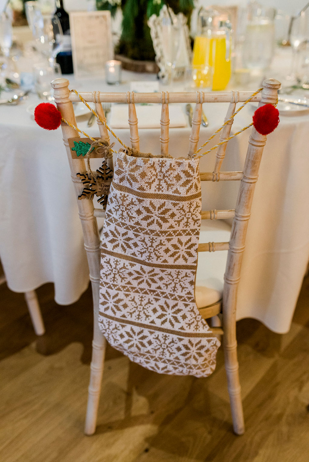 Christmas stocking hanging on a chair as childs wedding favour