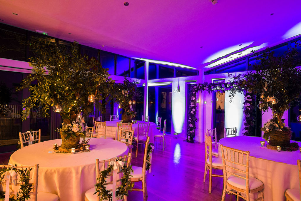 Magicel evening set-up of wedding at West Tower with purple upllighting