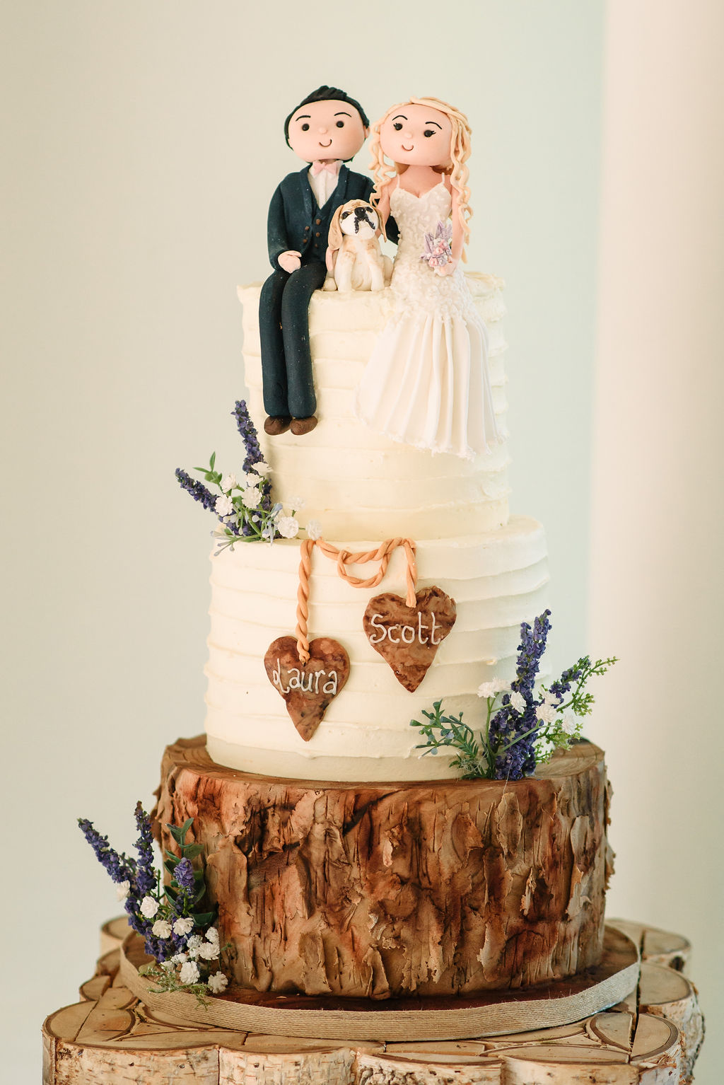 Wedding cake with bride, groom and their beagle for their spring wedding