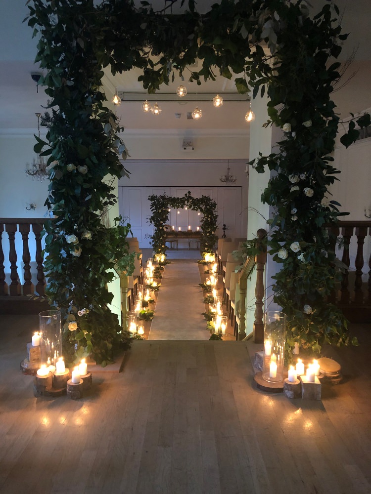 Archway & candlelit aisle at West Tower