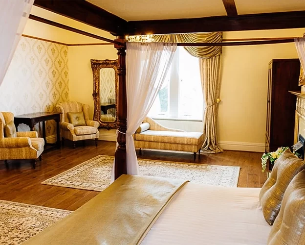 Dom Perignon Bridal Suite at West Tower with four poster bed, chaise longue and elegant seating ready for an overnight wedding stay.